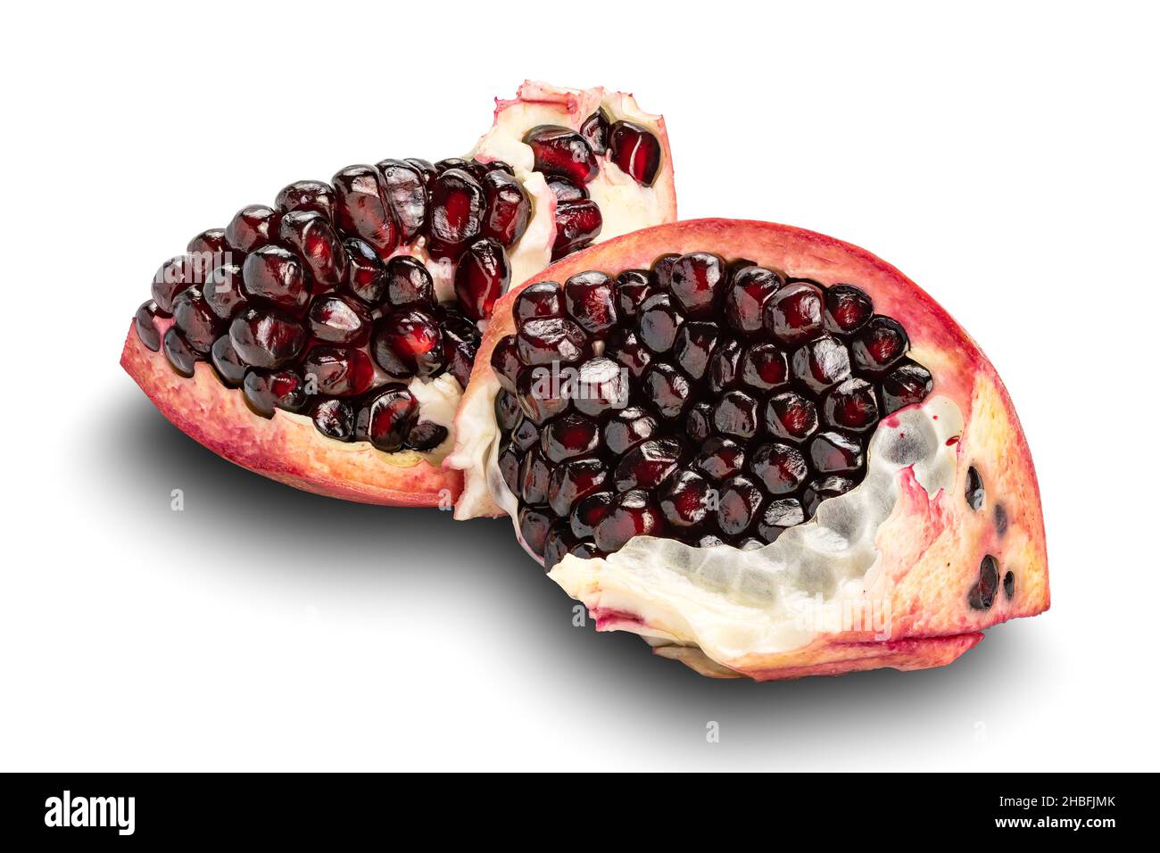 Pieces of ripe sweet pomegranate isolated on white background with clipping path. Stock Photo