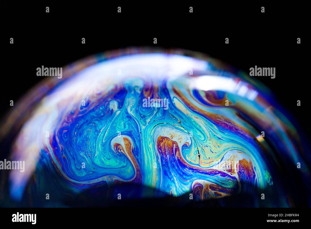 Abstract pattern, multicolored chaotic texture inside of the soap bubble, closeup Stock Photo