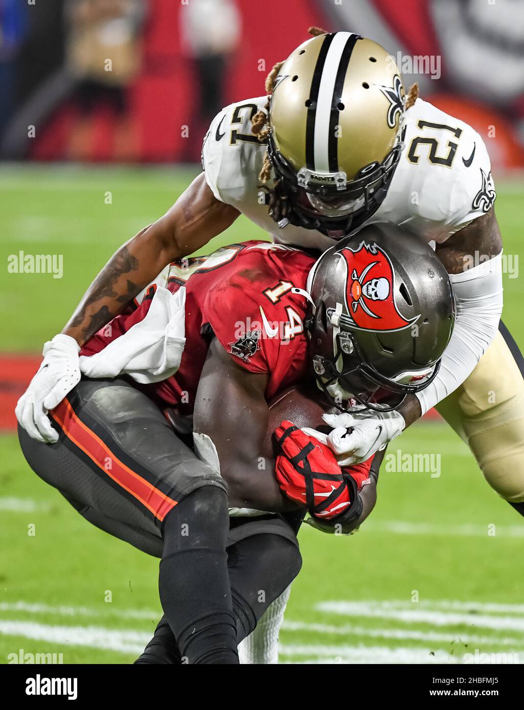 Tampa, United States. 19th Dec, 2021. New Orleans Saints' Bradley Roby (21) smothers Tampa Bay Buccaneers' Chris Godwin (14) during the first half at Raymond James Stadium in Tampa, Florida on Sunday, December 19, 2021. Photo by Steve Nesius/UPI Credit: UPI/Alamy Live News Stock Photo