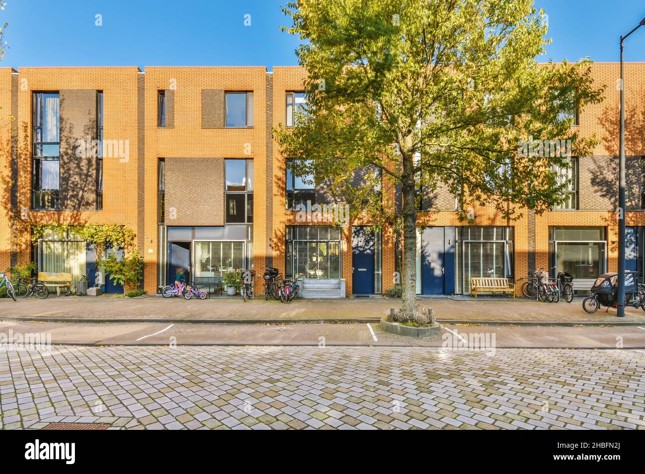 Building In The Sun Facade of an elegant building in the sun with parked bicycles Stock ...