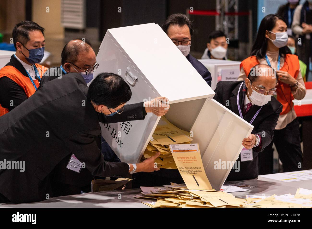 The first box of ballots was poured out by the Secretary for Constitutional and Mainland Affairs, Eric Tsang Kwok-wai, and The Chairman of the Electoral Affairs Commission Justice Barnabas Fung Wah to be counted.The 2021 Legislative Council General Election was held on December 19, as 30.2 percent turnout rate in the election, the lowest since 1997 as pro-China or pro-establishment candidates winning a sweeping victory. This is the first major election for the legislative council since the electoral system reformation, a major crackdown on pro-democratic parties and the establishment of Hong K Stock Photo