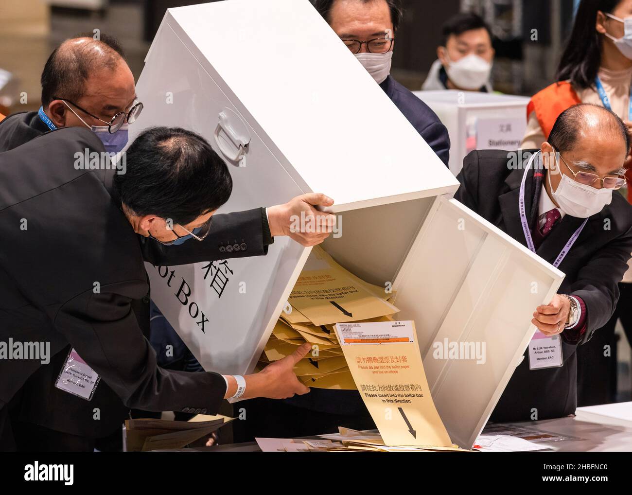 The first box of ballots was poured out by the Secretary for Constitutional and Mainland Affairs, Eric Tsang Kwok-wai, and The Chairman of the Electoral Affairs Commission Justice Barnabas Fung Wah to be counted.The 2021 Legislative Council General Election was held on December 19, as 30.2 percent turnout rate in the election, the lowest since 1997 as pro-China or pro-establishment candidates winning a sweeping victory. This is the first major election for the legislative council since the electoral system reformation, a major crackdown on pro-democratic parties and the establishment of Hong K Stock Photo