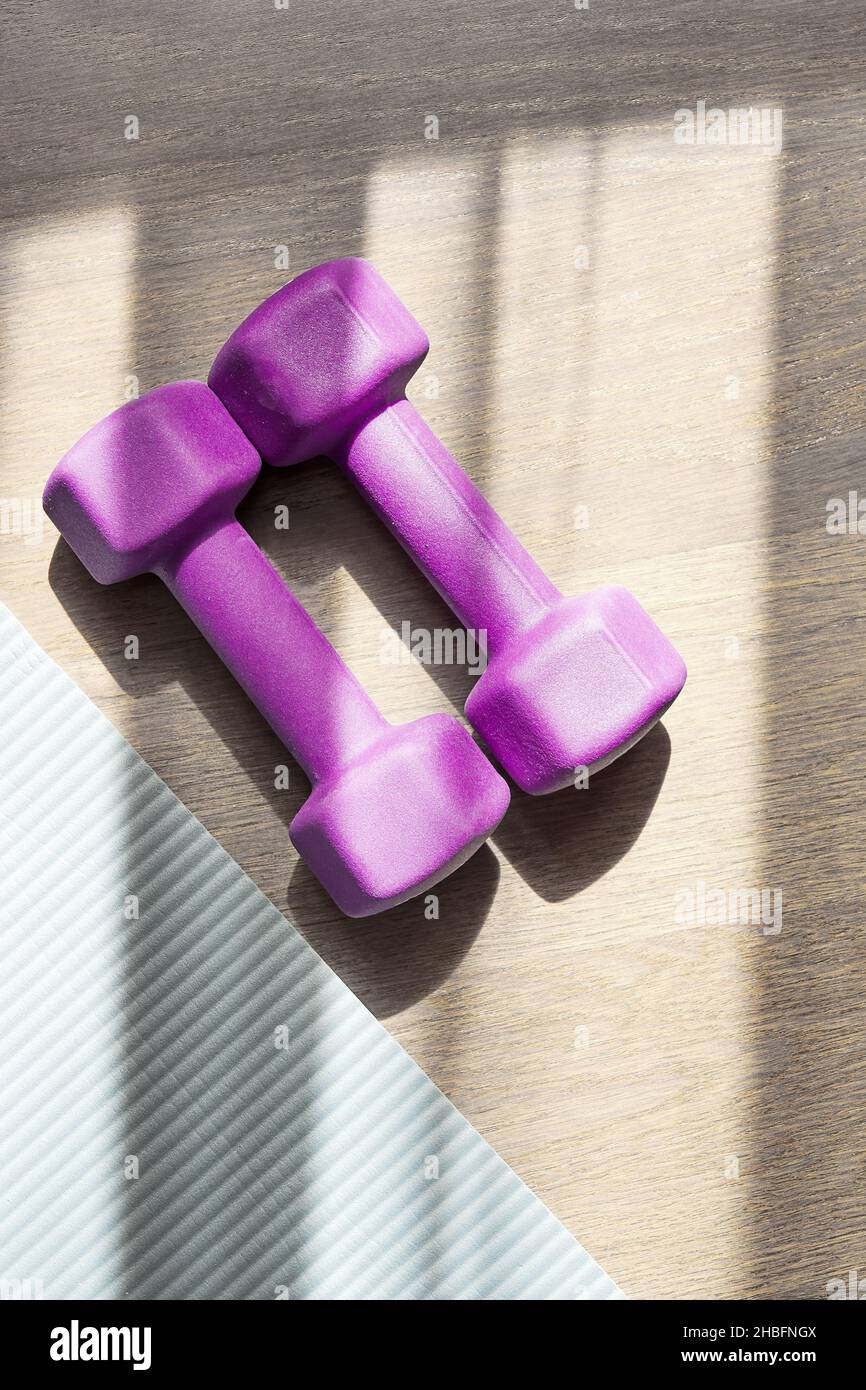 Vertical flat-lay template of fitness stuff on the floor. Sports equipment Stock Photo