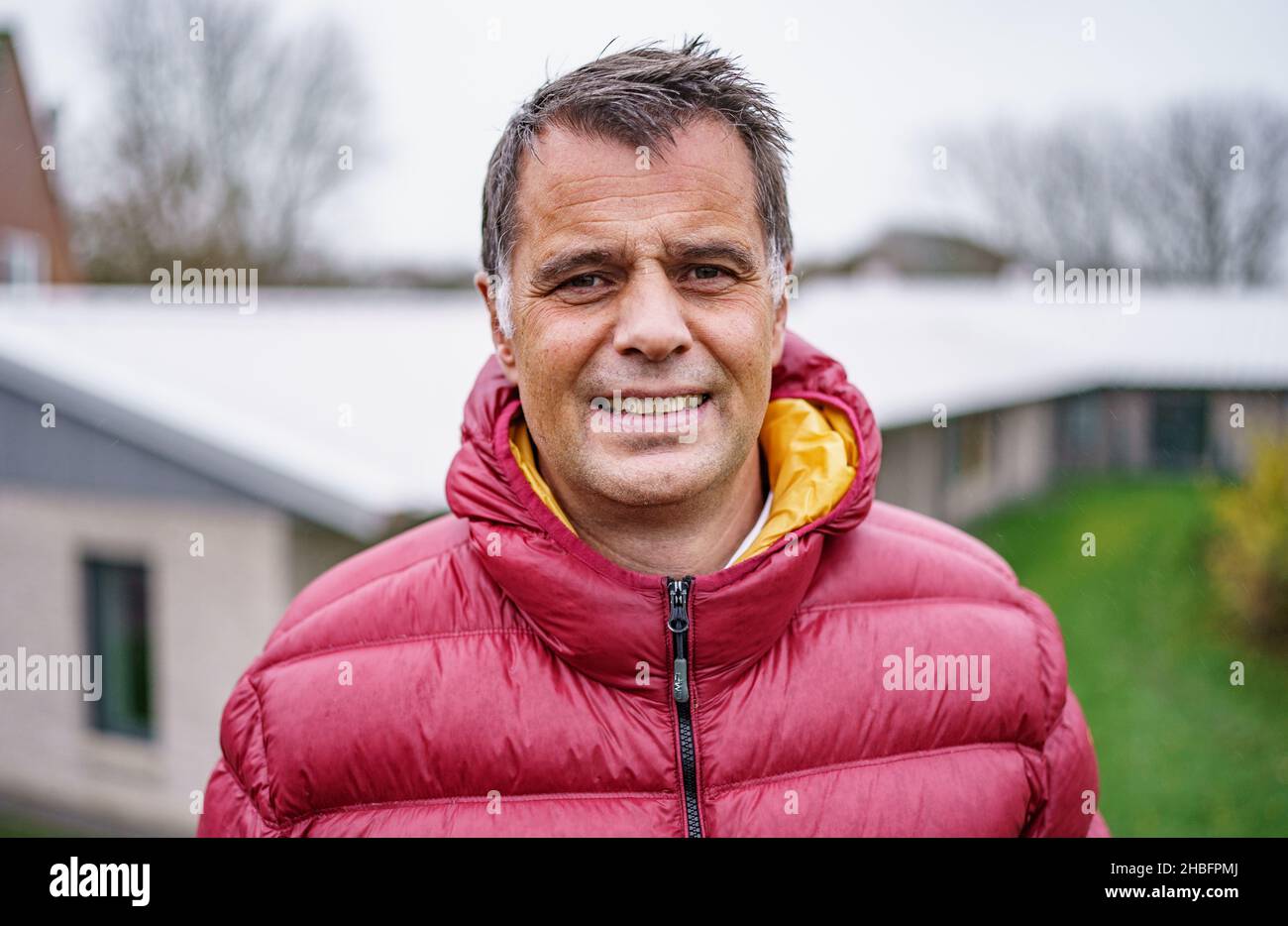 Insel Pellworm, Germany. 18th Nov, 2021. Walter Herrig, principal of the Hermann Neuton Paulsen School on the island of Pellworm, stands in front of one of the school buildings. The search for teachers for the island often takes longer than in larger towns. Credit: Axel Heimken/dpa/Alamy Live News Stock Photo