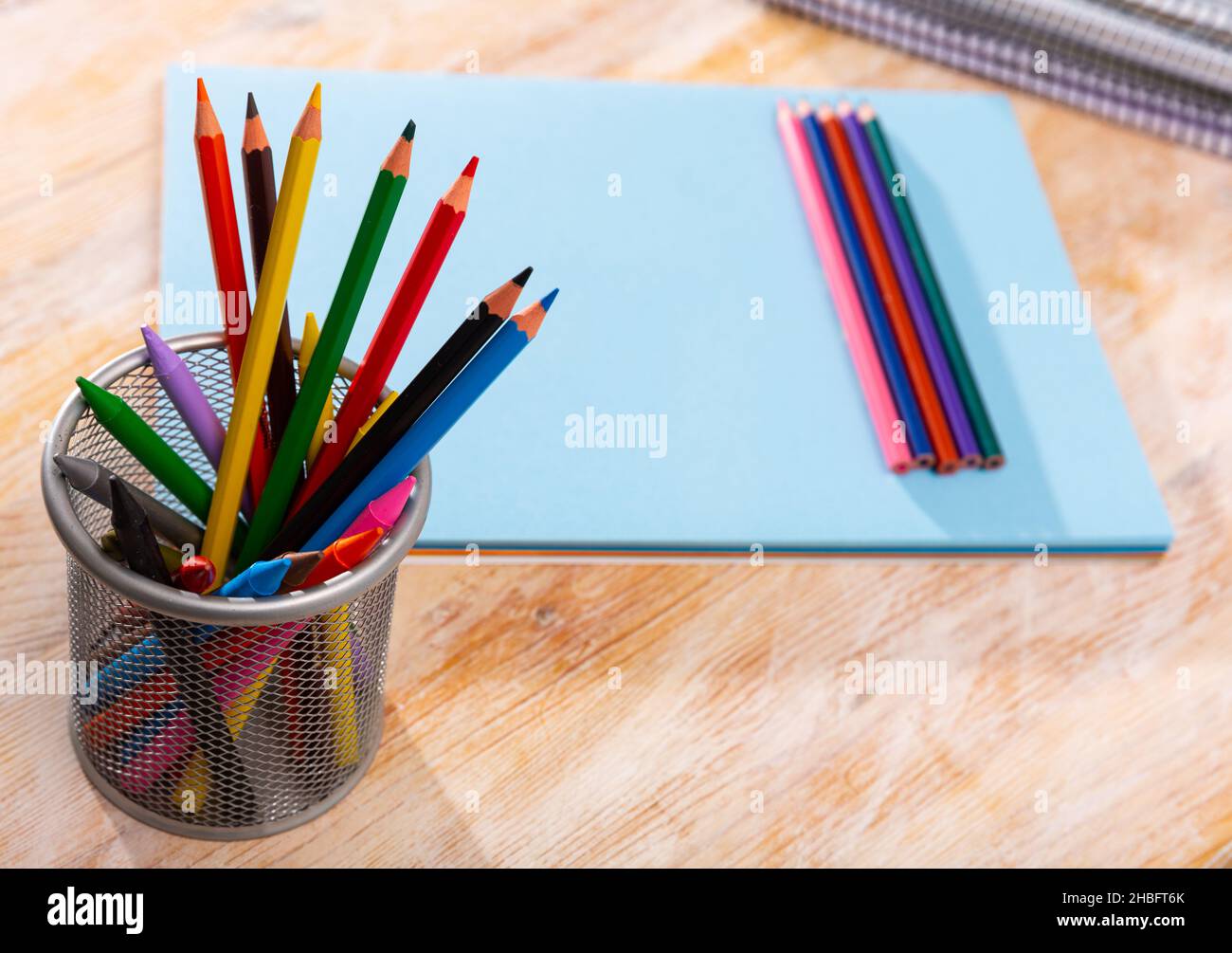 Colored pencils kept in pencil holder Stock Photo Alamy