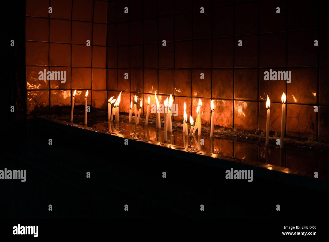 Votive candles. Prayer candles of the Catholic Church. Christianity