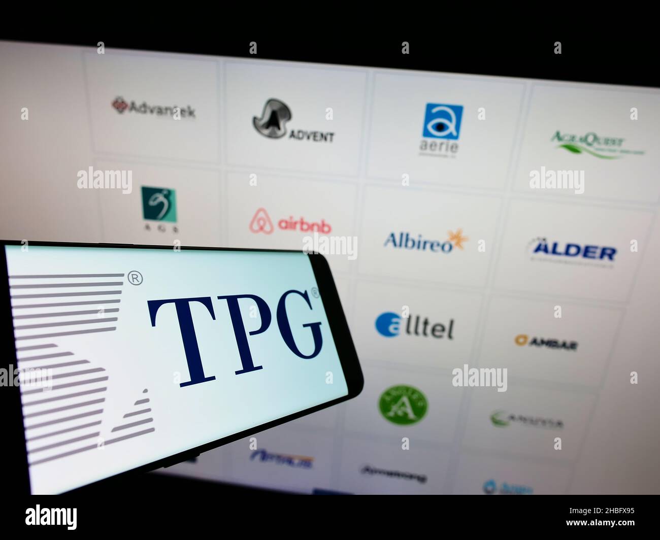 Smartphone with logo of American investment company TPG Capital on screen in front of business website. Focus on center of phone display. Stock Photo