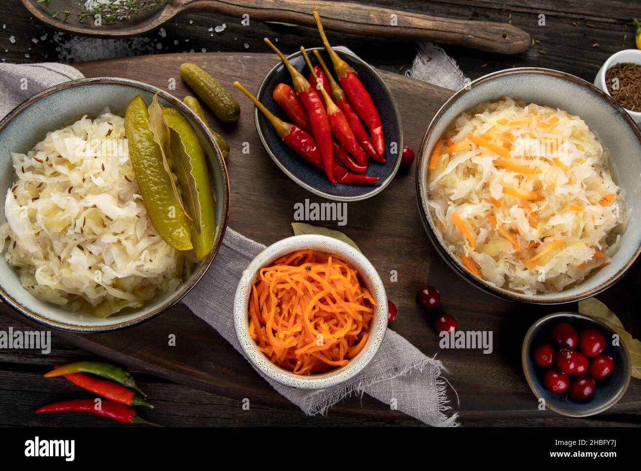 Pickled vegetables on wooden background. Salting vegetables. Top view, flat lay Stock Photo