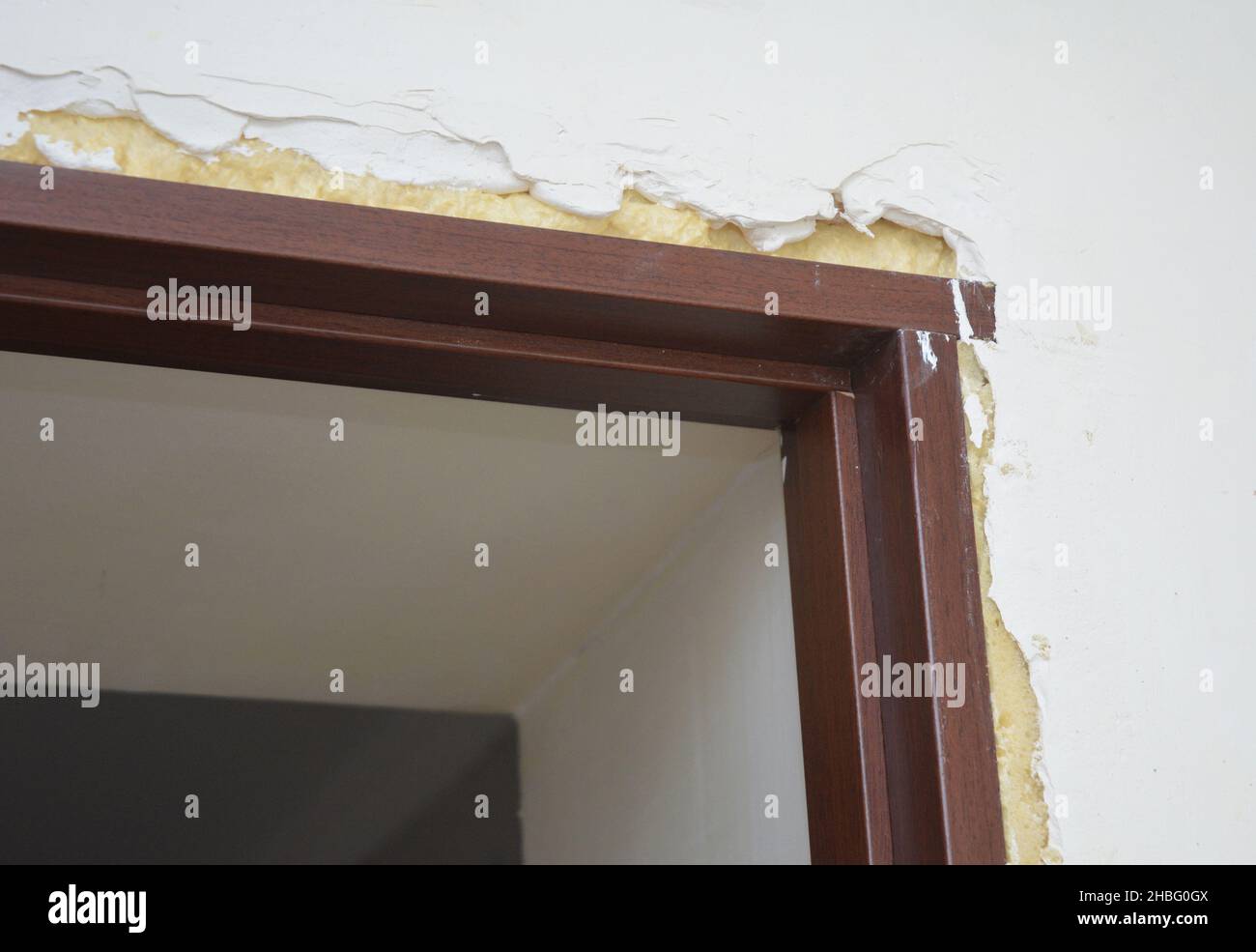 Interior door installation. Door frame assembly and filling the gaps