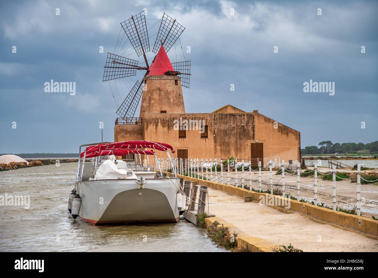 Salt Pans near Marsala at Sicily with windmill, Italy Stock Photo