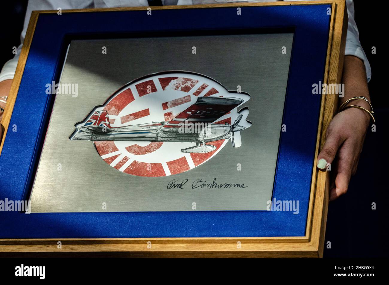 Pilot Paul Bonhomme presented with a commemorative gift from the Red Bull Air Race team following the racing at Royal Ascot racecourse Stock Photo