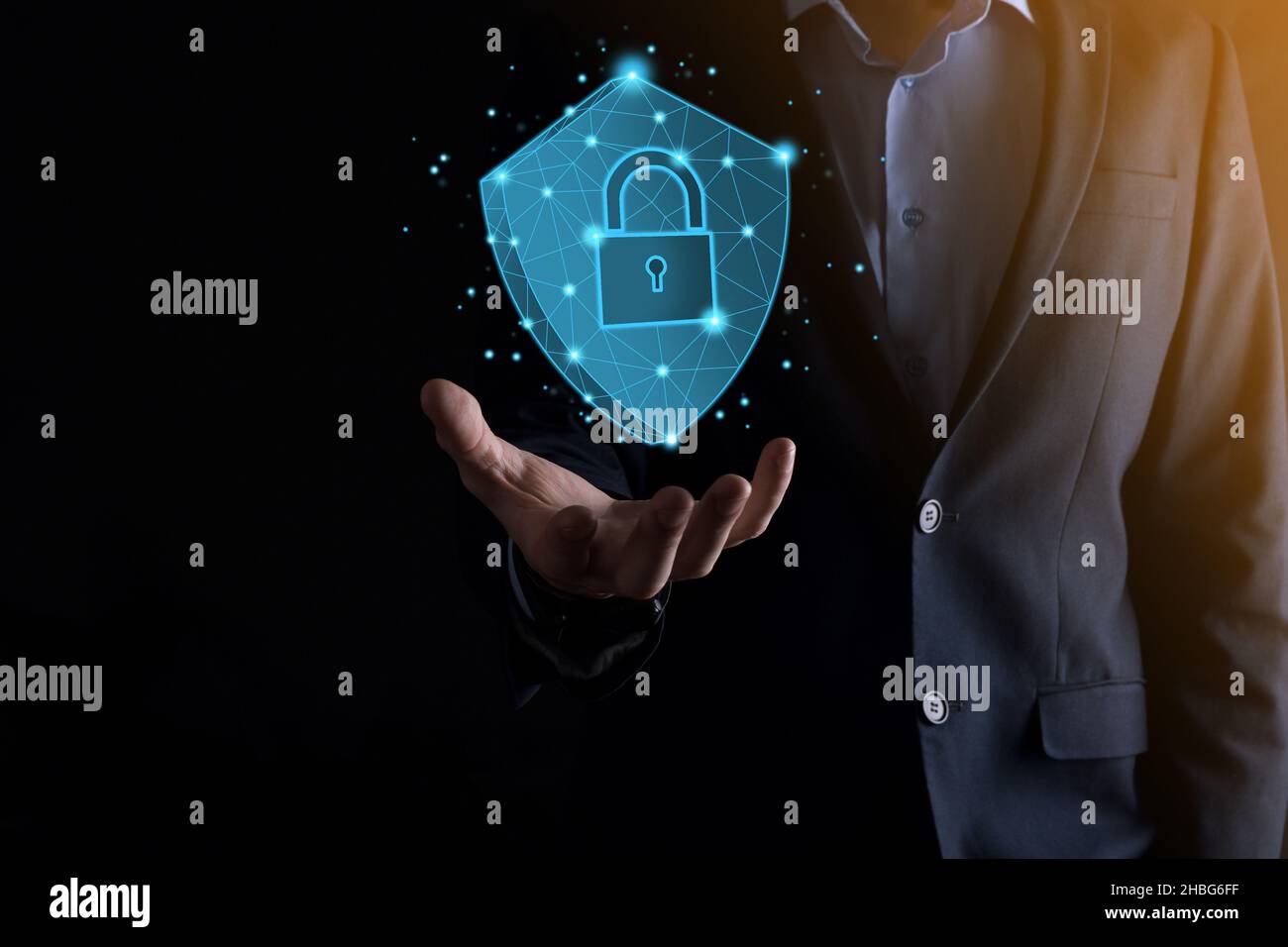 Businessman hold low poly polygon shield with a padlock icon.Secure ...