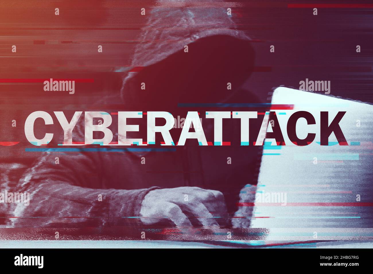 Cyberattack concept, hooded computer hacker working on laptop, glitch effect added in post, selective focus Stock Photo