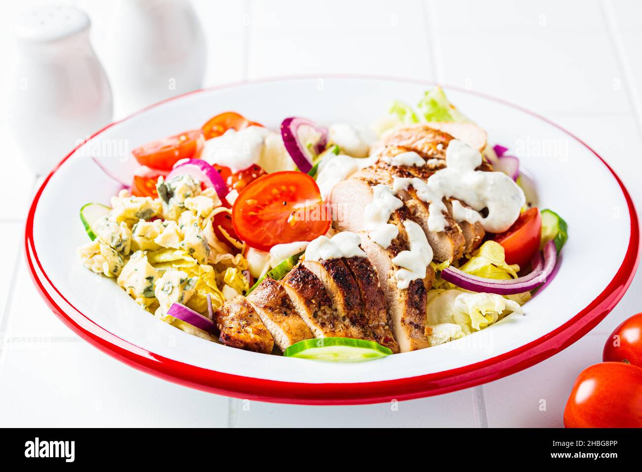 Buffalo chicken salad with cheese, tomato, cucumber and