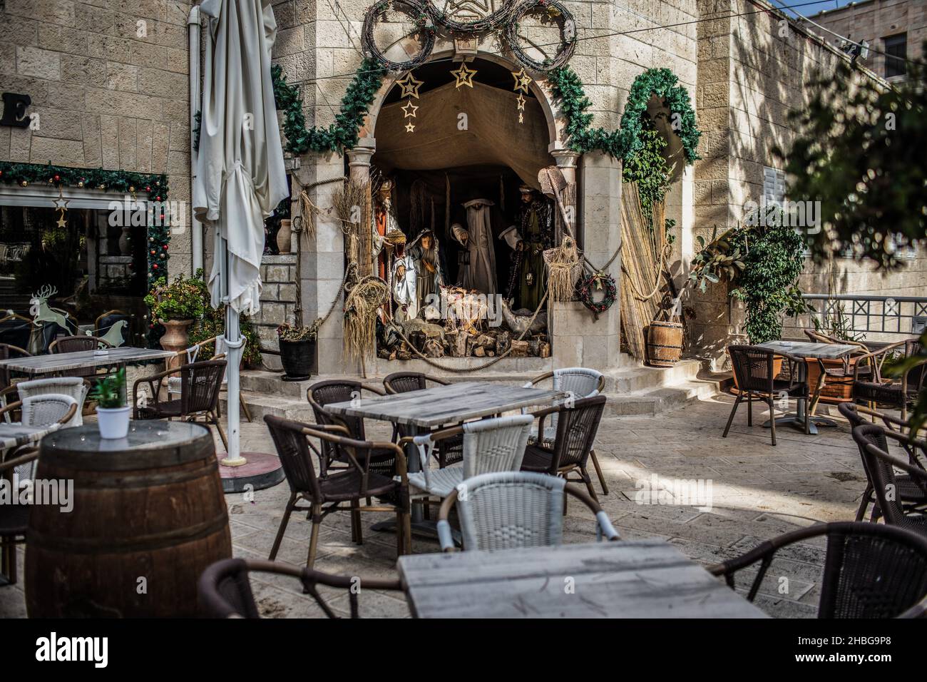 Bethlehem, Palestinian Territories. 15th Dec, 2021. A photo made available on 20 December 2021 shows a nativity scene displayed in an empty coffee shop outside of the Church of Nativity ahead of Christmas. Credit: Ilia Yefimovich/dpa/Alamy Live News Stock Photo