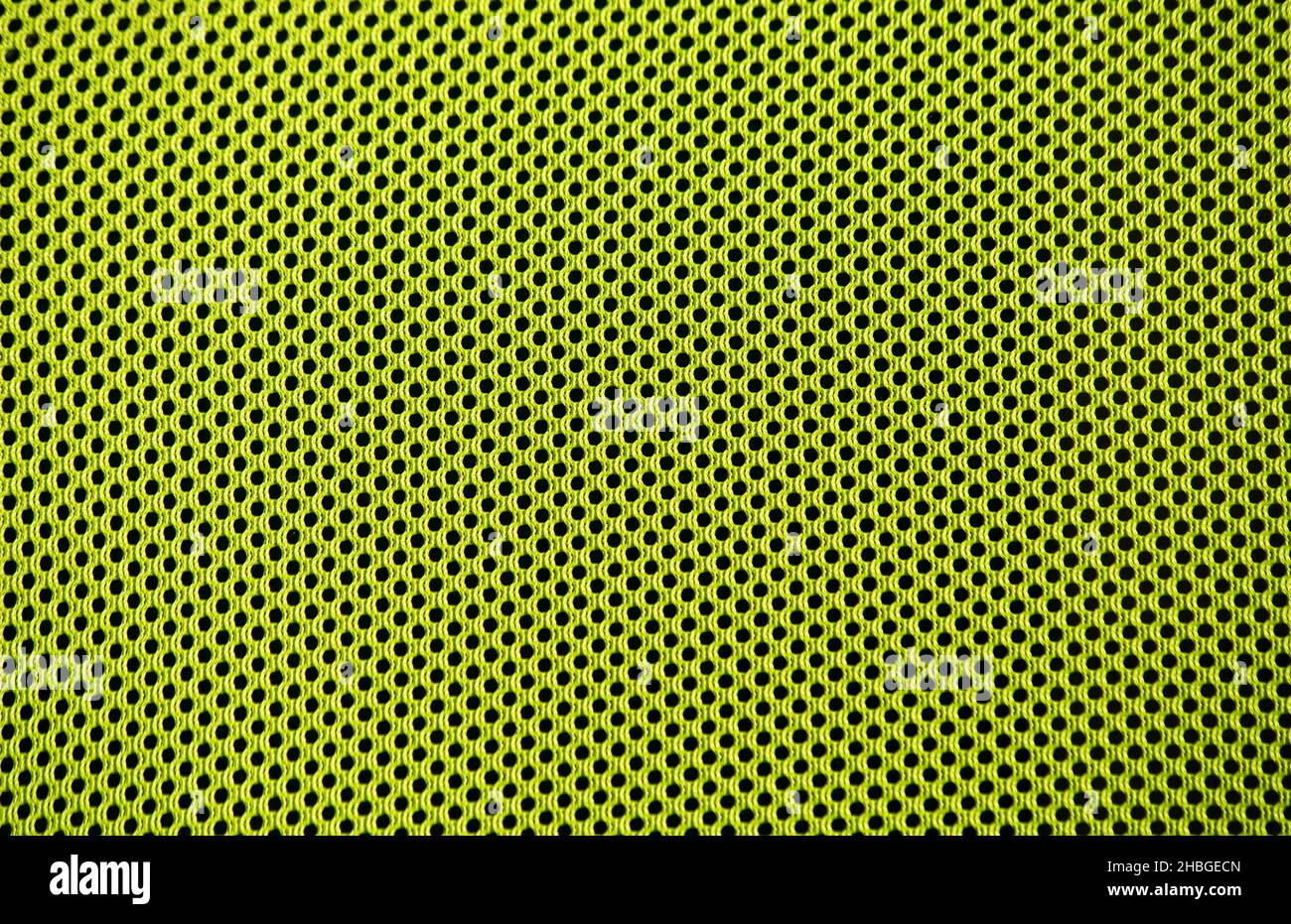 A light green texture with hole pattern. cool background for spring and summer images. Stock Photo