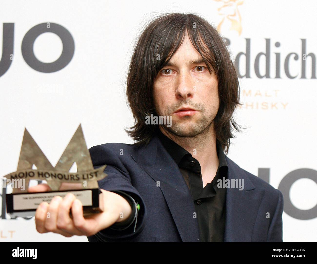 Bobby Gillespie of Primal Scream with award for Mojo Classic Album for 'Screamadelica' at the Mojo Awards at The Brewery in London. Stock Photo