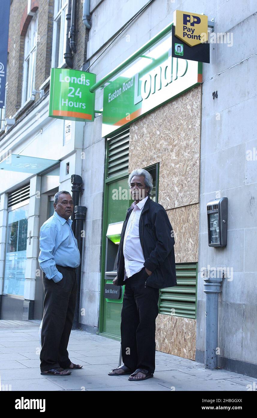 Londis on Warren Street is boarded up in preparation of potential riots in London. Stock Photo