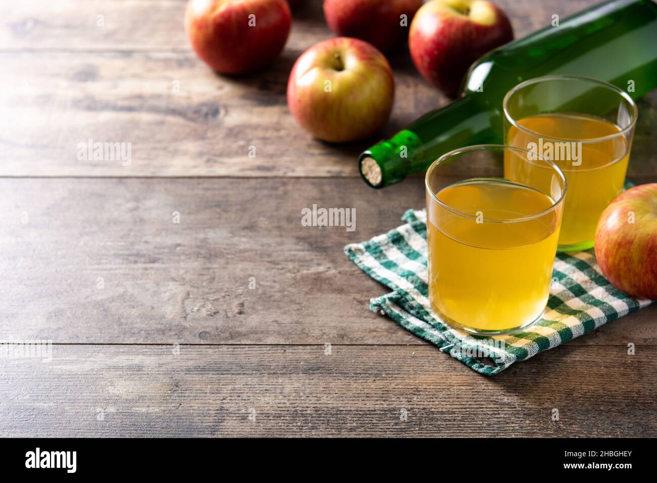 Apple cider drink on rustic wooden table Stock Photo