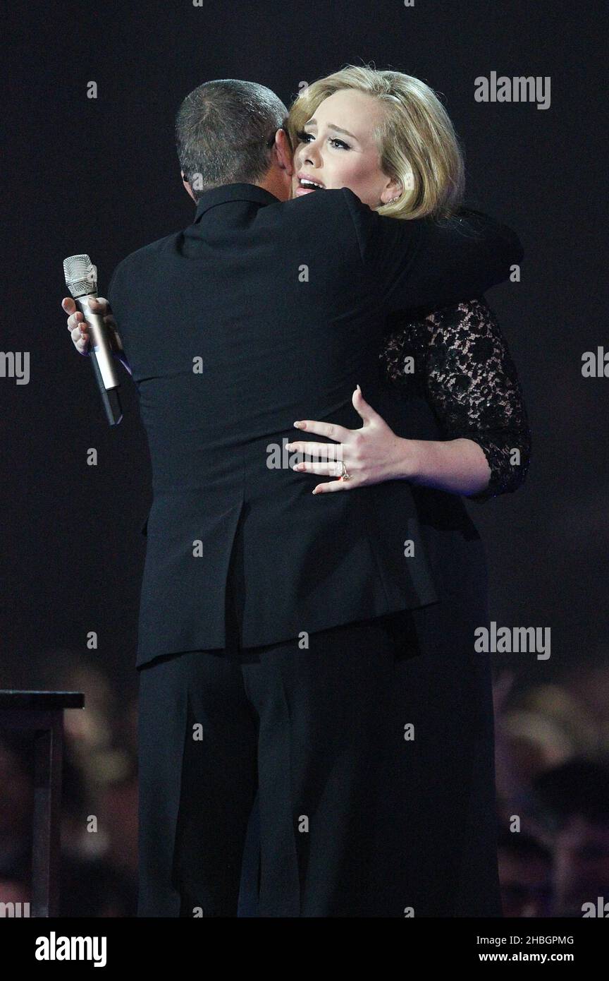 George Michael presents Adele with Mastercard Album of the Year Award during the 2012 Brit awards at The O2 Arena, London. Stock Photo