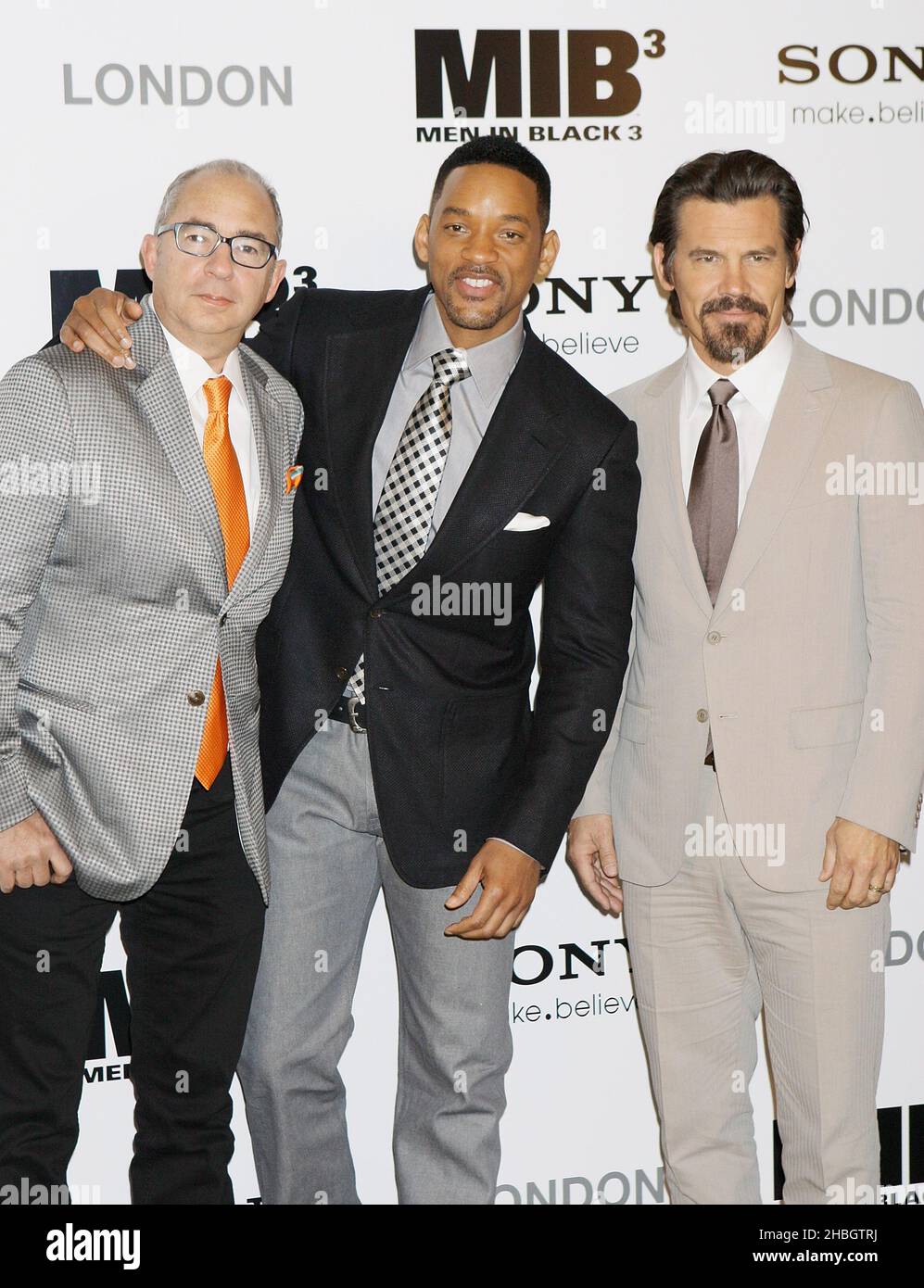 L-R; Director Barry Sonnenfeld with Will Smith and Josh Brolin attend The Cast Photocall for the UK Launch of Men in Black at the Dorchester Hotel in London on 16 May, 2012. Stock Photo