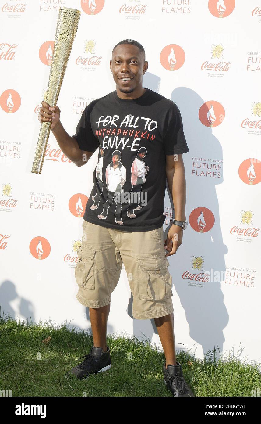 Dizzee Rascal 2012 Dizzee Rascal poses backstage with the Torch at Coca-Cola's London 2012 ...
