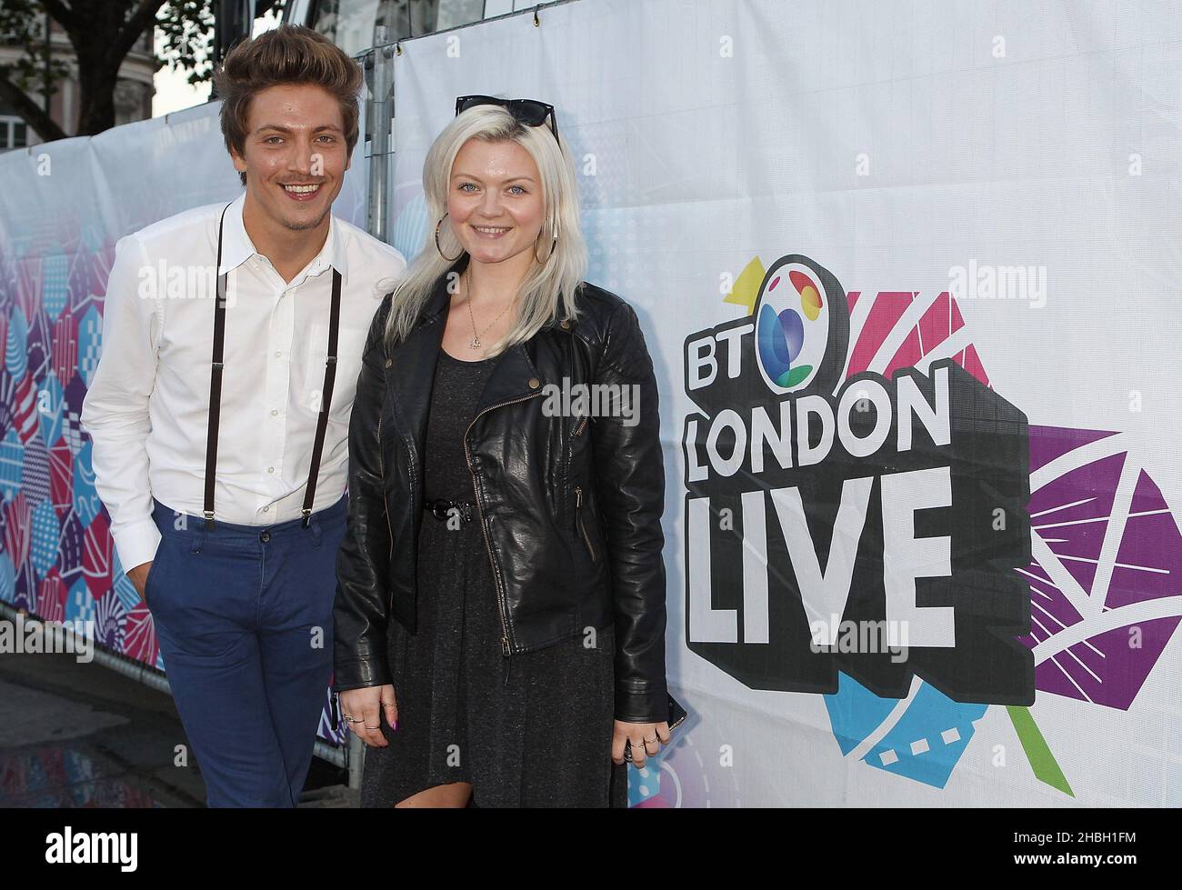Tyler James, singer/songwriter from the Voice, with DJ Polly James of Absolute Radio at the BT London Live Paralympics Opening Ceremony at Trafalgar Square in London. Stock Photo