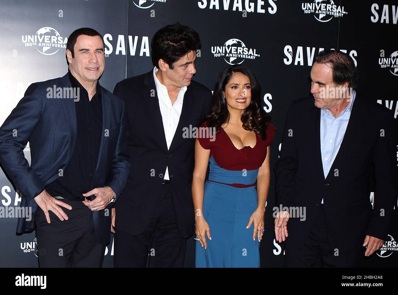 (L-R)John Travolta, Benicio Del Toro,Salma Hayek and Oliver Stone seen at a Photocall for upcoming UK cinema release Savages at The Oriental Mandarin Hotel in London. Stock Photo