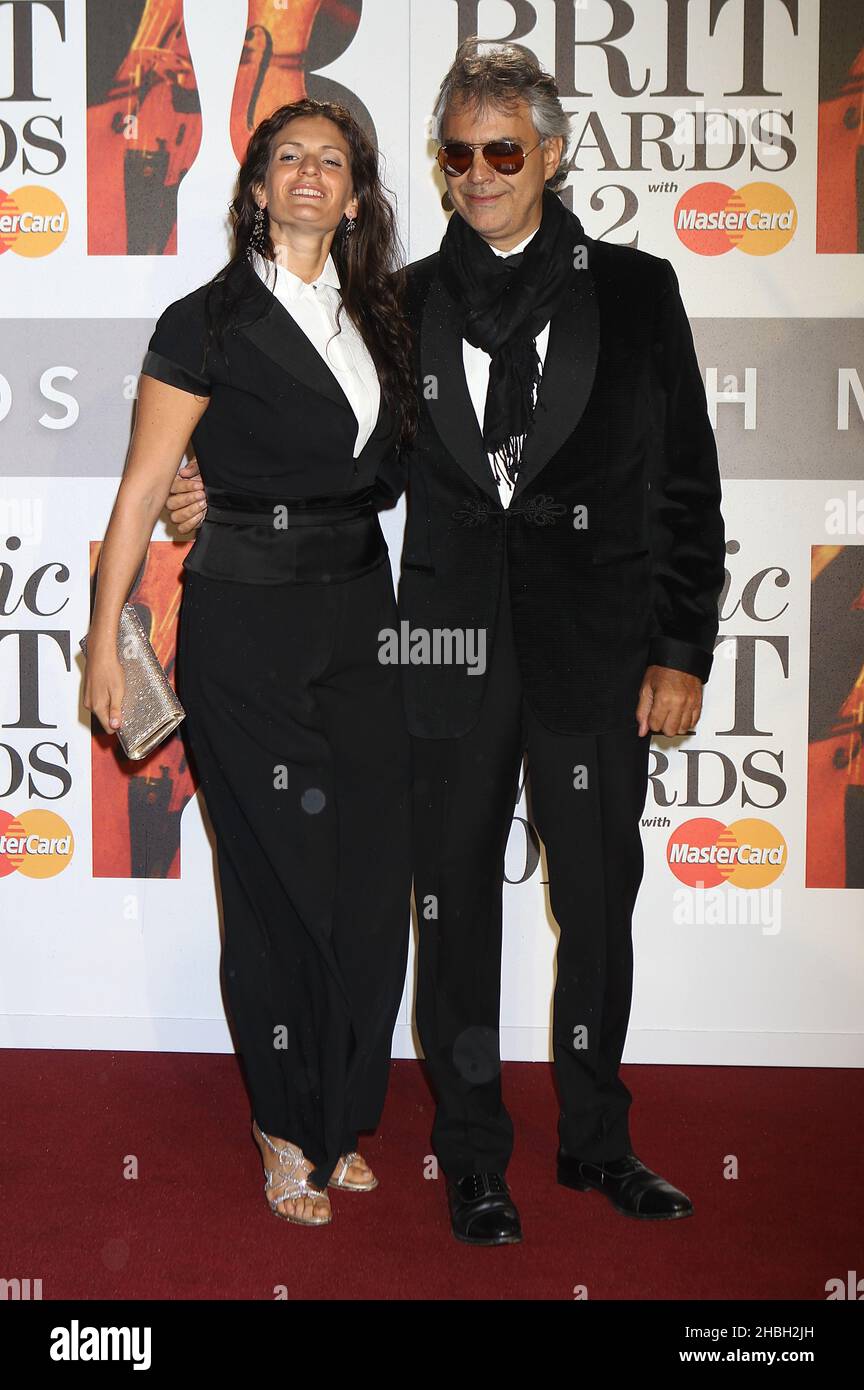 Andrea Bocelli in an armchair with his wife Enrica Cenzatti and