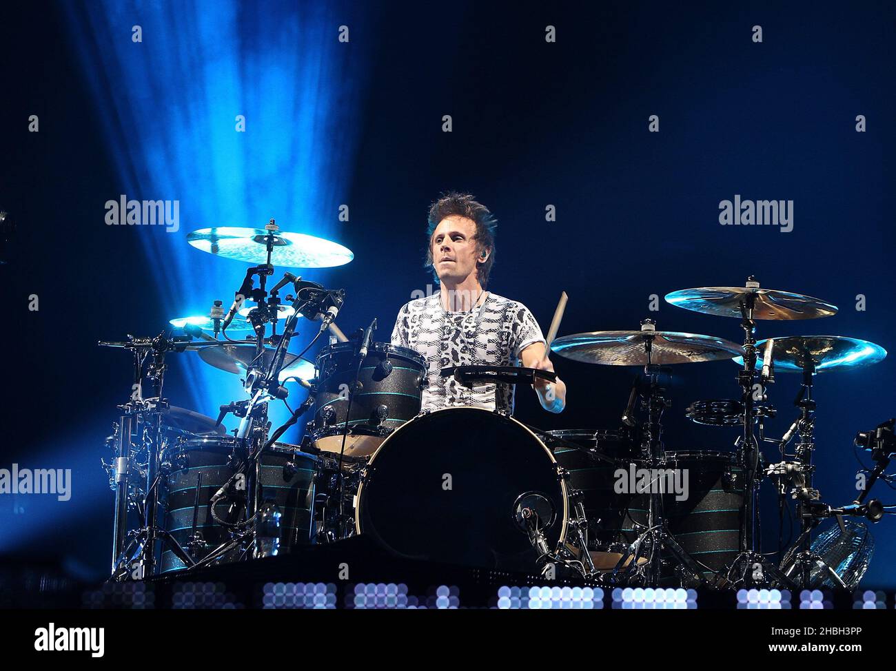 Dominic Howard Of Muse Performs On Stage At The 02 Arena In London Stock Photo Alamy