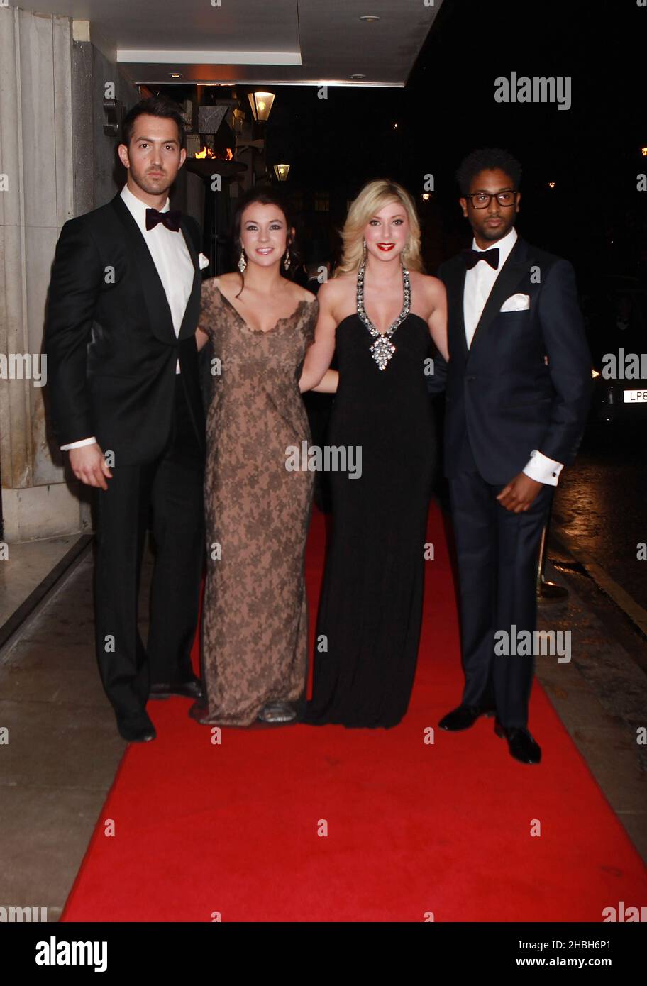 David Webb, Monica McGhee, Victoria Gray and Peter Braithwaite of Amore Tribute Band attend the Helping Hands VIP fundraising dinner at the Savoy Hotel in London. Stock Photo