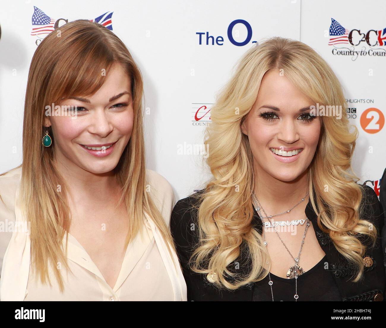 (LR) Lee Ann Rimes and Carrie Underwood pose back stage at the C2C