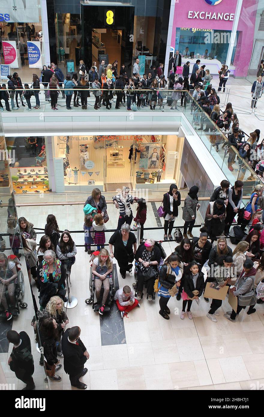 Fans outside attending a photocall for Little Mix's press on nail