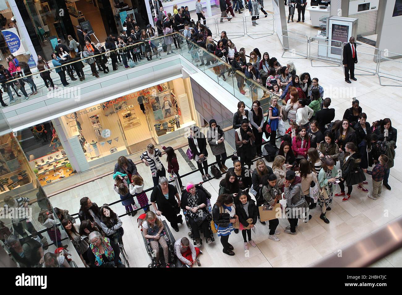Fans outside attending a photocall for Little Mix's press on nail