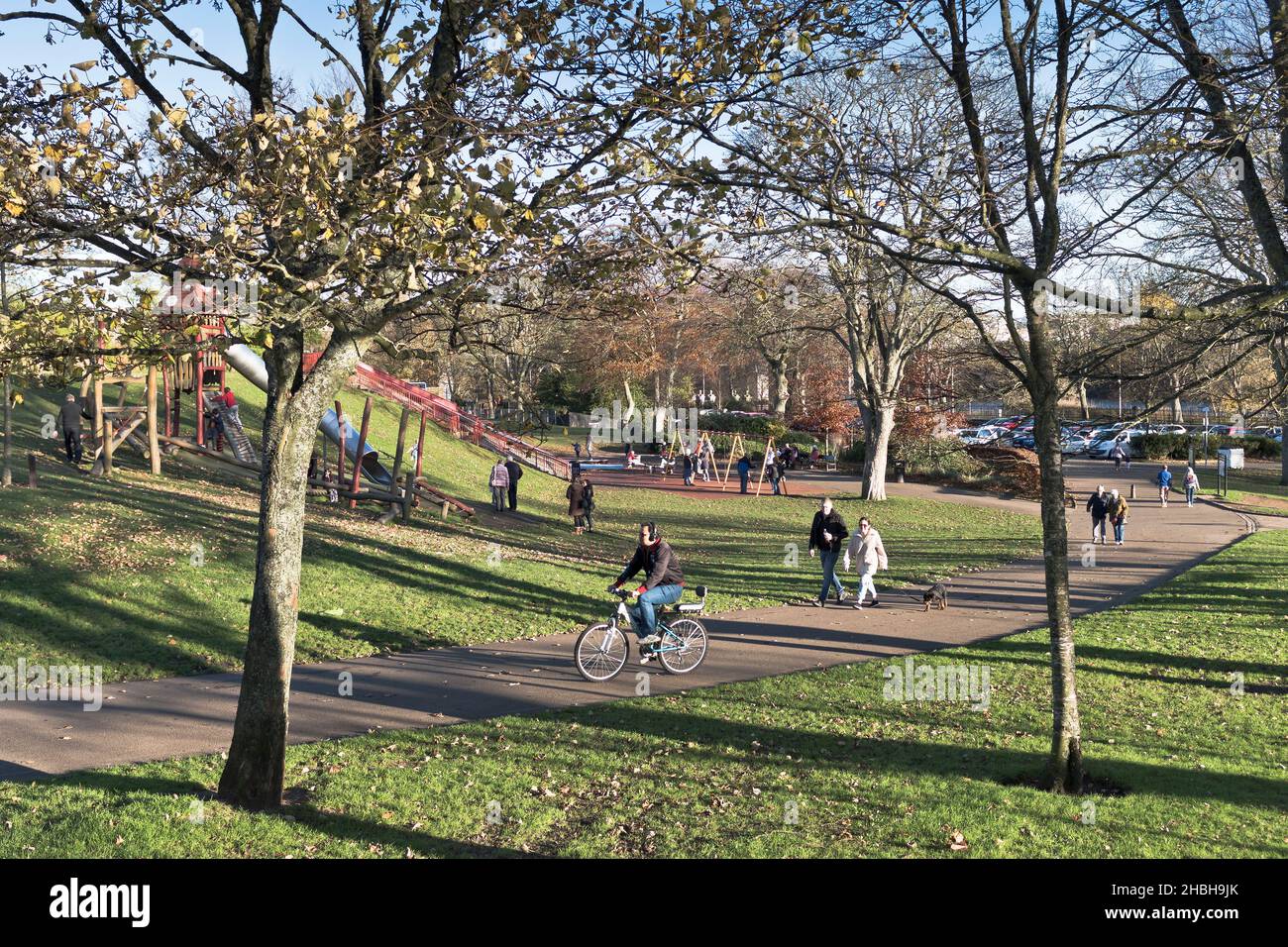 dh Duthie Park ABERDEEN SCOTLAND People sitting relaxing walking in parks winter day Stock Photo