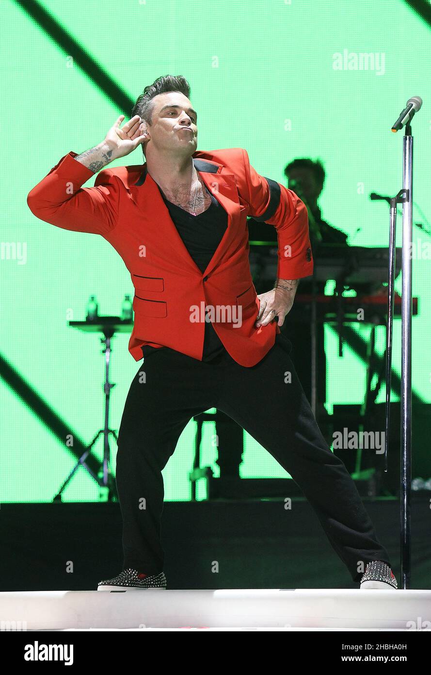 Robbie Williams performs on stage at Capital FM's Summertime Ball at Wembley Stadium, London. Stock Photo