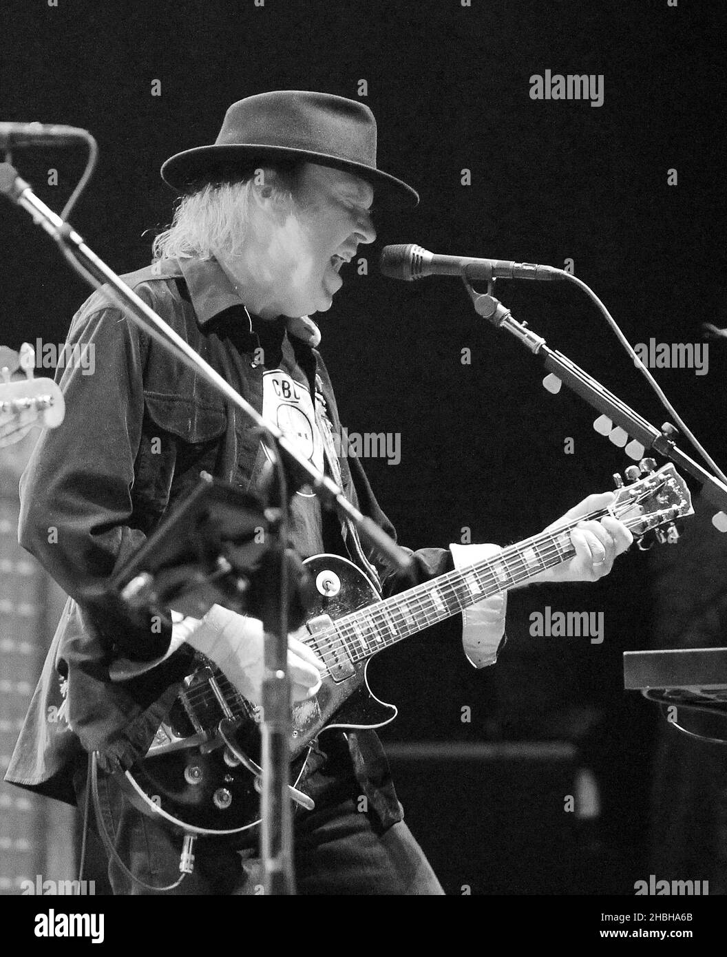 Neil Young performs on stage at the 02 Arena in London. Stock Photo