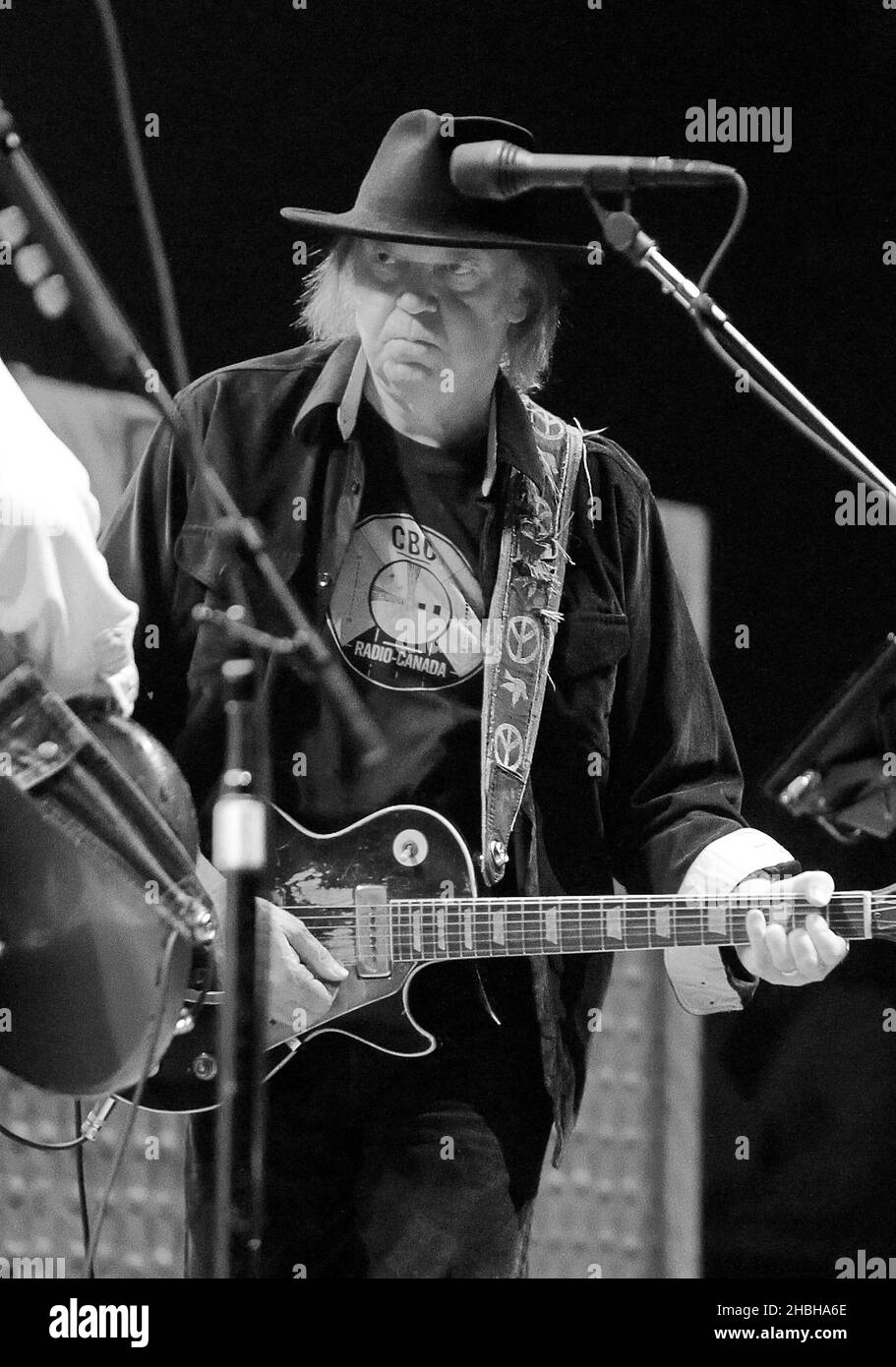 Neil Young performs on stage at the 02 Arena in London. Stock Photo