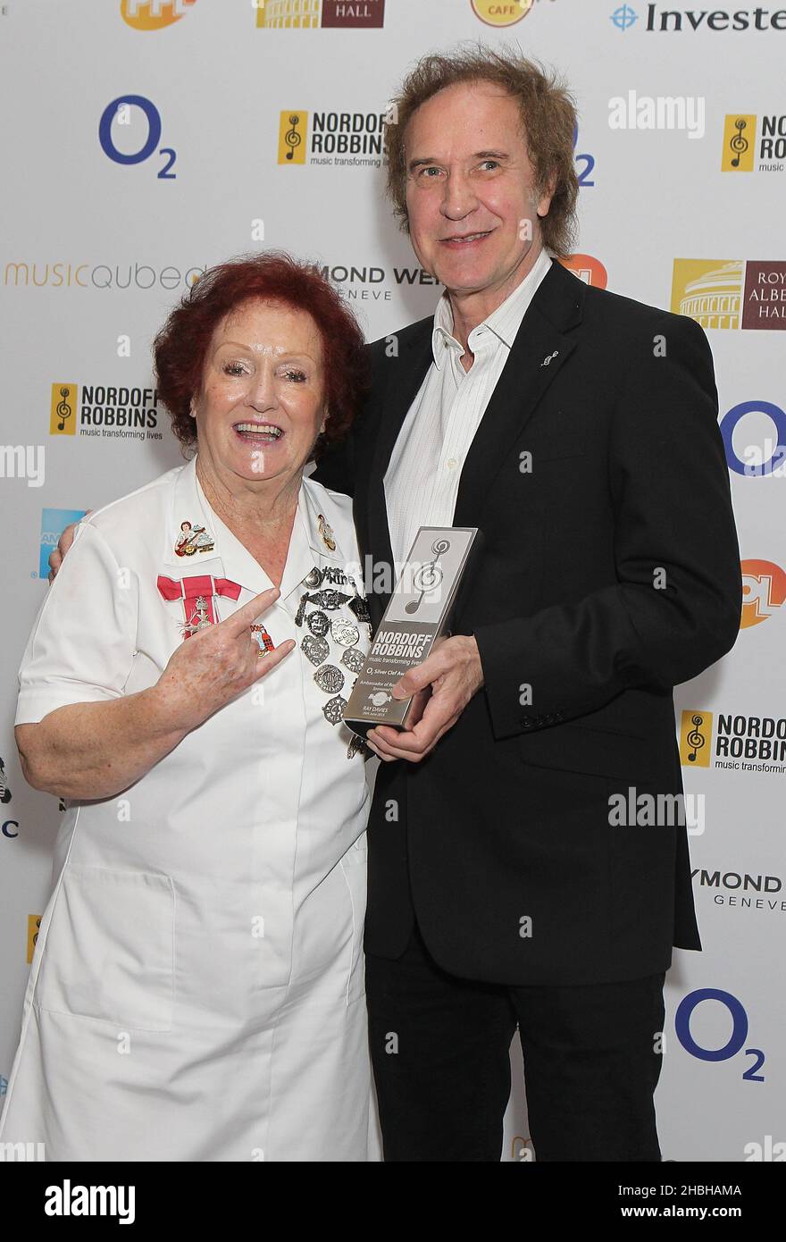 Rita Gilligan head waitress from the Hard Rock Cafe with Ray Davies and his Hard Rock Cafe Ambassador of Rock Award at the Nordoff Robbins Silver Clef Awards at the Hilton Hotel in London. Stock Photo