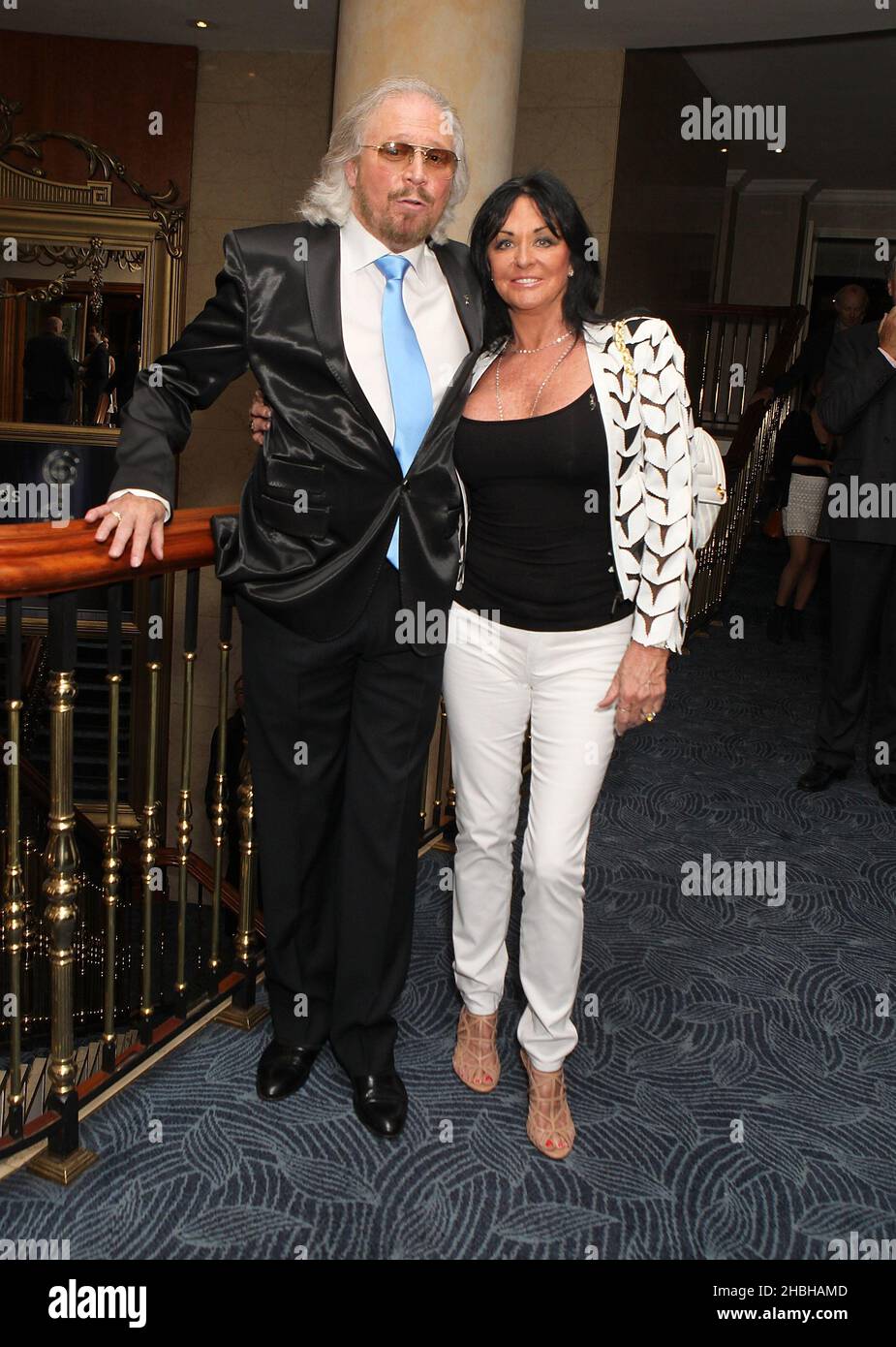 Barry Gibb and wife Linda Gray attending the Nordoff Robbins Silver Clef Awards at the Hilton Hotel in London. Stock Photo
