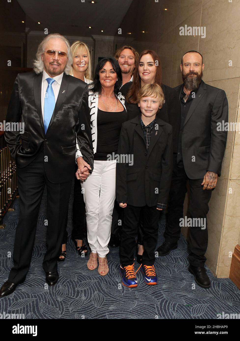 Barry Gibb and Linda Gibb and family attending the Nordoff Robbins Silver Clef Awards at the Hilton Hotel in London. Stock Photo