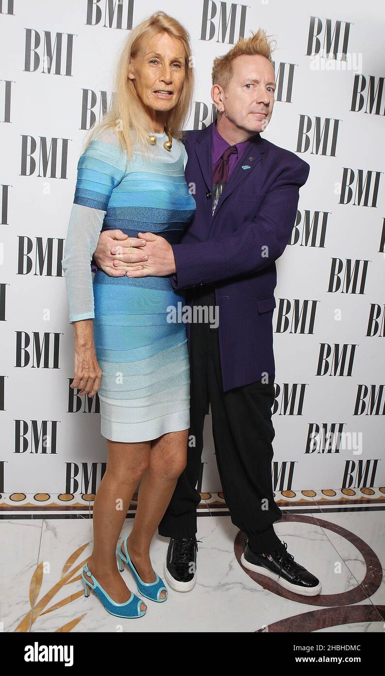 Johnny Lydon and wife Nora attend and wins the BMI Icon Award at the BMI Awards at the Dorchester in Central London. Stock Photo
