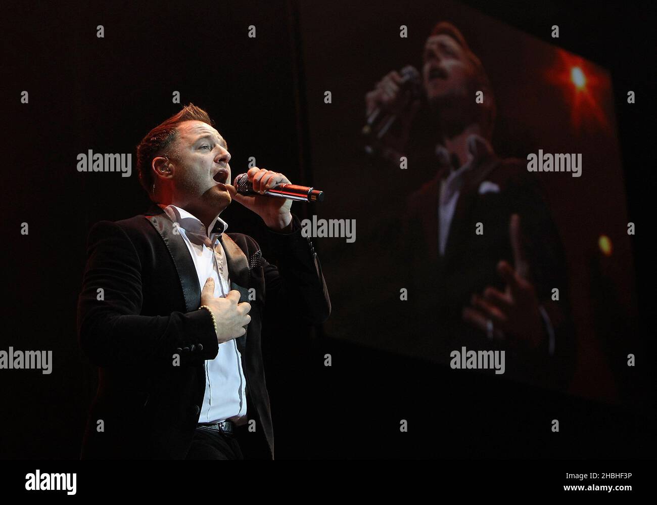 Mikey Graham of Boyzone performs on stage at the 02 Arena in London. Stock Photo