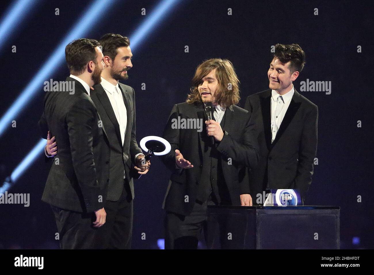 Bastille accept the award for Best Newcomer during the 2014 Brit Awards at the O2 Arena, London. Stock Photo