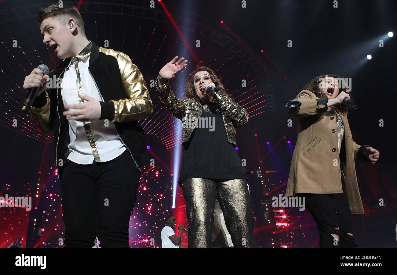 Nicholas McDonald,Sam Bailey and Luke Friend perform on stage at Wembley Arena during the X Factor 2014 live tour in London. Stock Photo