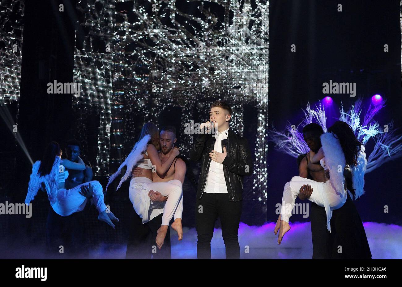Nicholas McDonald performs on stage at Wembley Arena during the X Factor 2014 live tour in London. Stock Photo