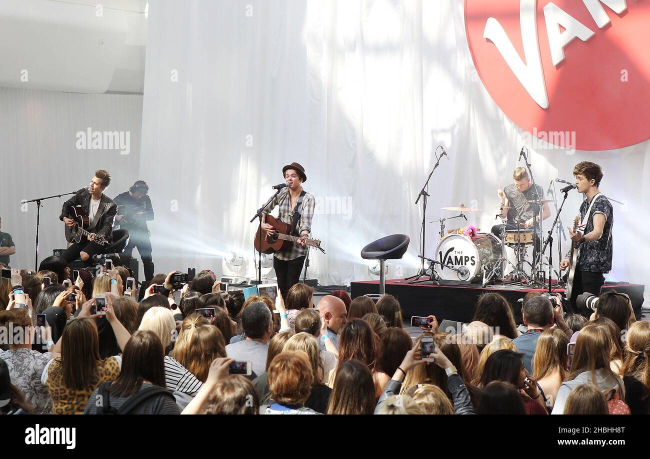 James McVey,Bradley Simpson,Tristan Evans and Connor Ball of The Vamps perform on stage at Westfield White City in London. Stock Photo