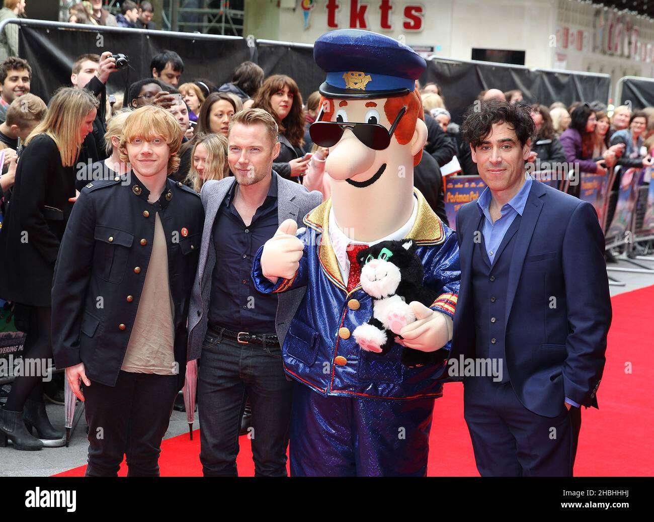 Rupert Grint, Ronan Keating, Postman Pat and Stephen Mangan attending the Postman Pat The Movie World Premier at The West End Odeon in Leicester Square in London. Stock Photo