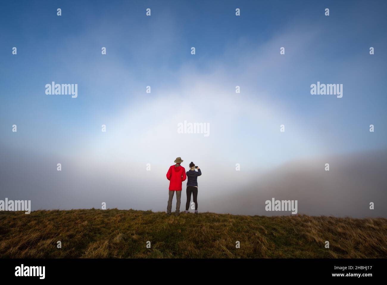 People taking photos of a Fogbow or Fog Bow in the Campsie Fells, Scotland, UK Stock Photo