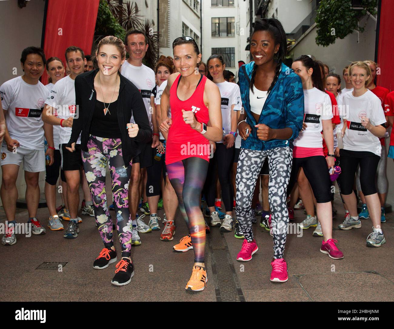 Olympic medalist Victoria Pendleton joins TV stars Ashley James (L) and AJ Odudu (R) attending a photocall for Fitness First Home Run in London. Stock Photo